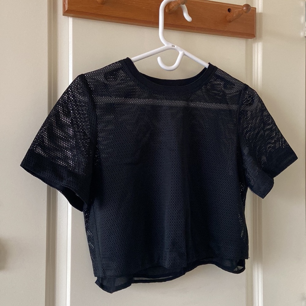Fishnet shirt with a mesh camisole inside
